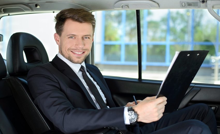 Businessman In The Car - Moe’s Limousine & Black Car Service Moe’s Limousine & Black Car Service